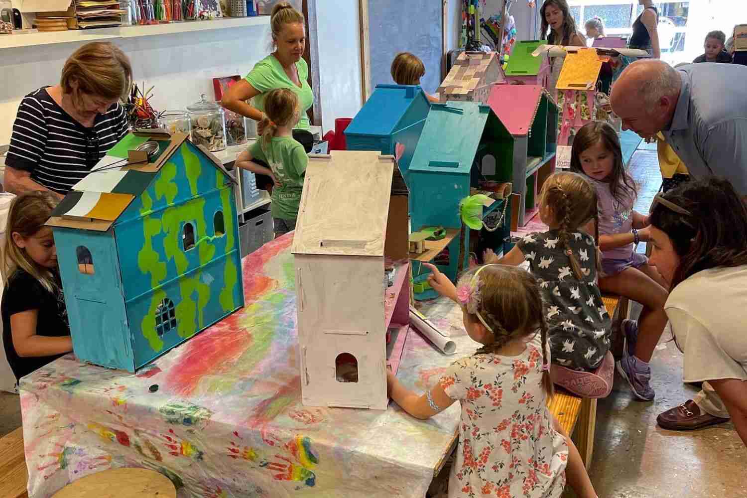 Different Ages Play and Learn with Their Dollhouse